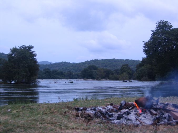 The burned down camp fire at the banks of the Cauvery River
